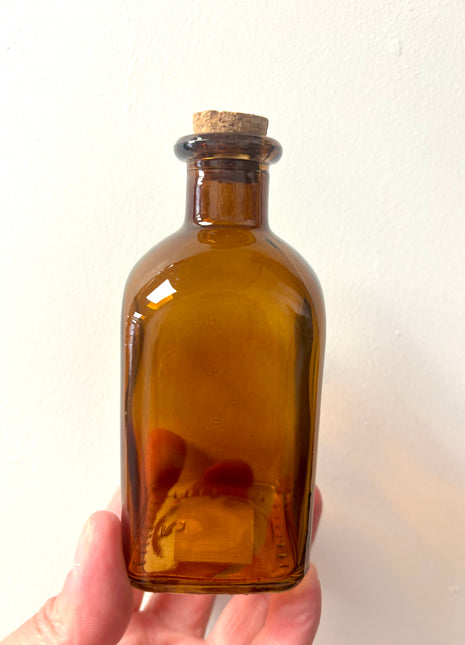 Brown square top bottle