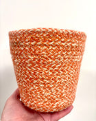 Orange wicker pots