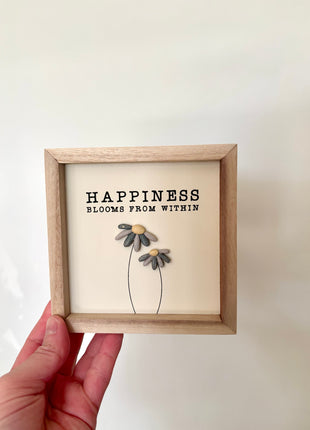 Happiness pebble sign