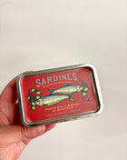 Sardines candle in a tin