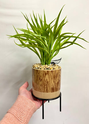Faux grass with decorative planter