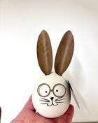 Wooden rabbit with glasses