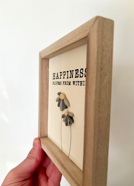 Happiness pebble sign