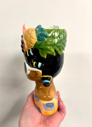 Lady vase with fruit hat
