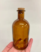 Cork topped brown bottle