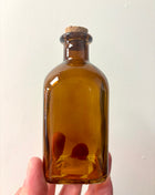 Brown square top bottle