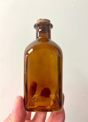 Brown square top bottle