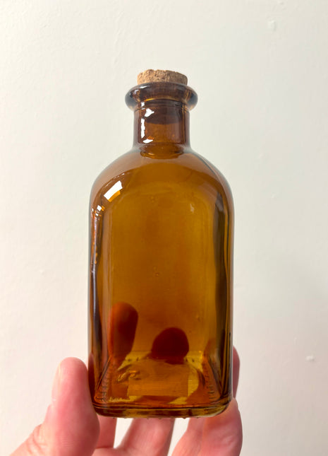 Brown square top bottle
