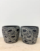 Black fossil pot