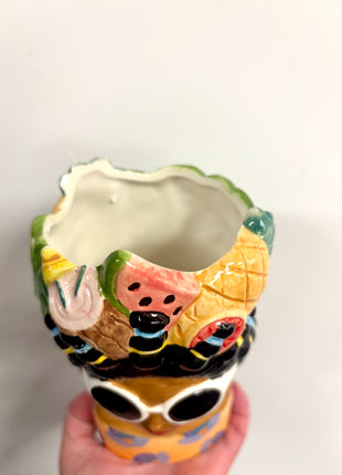 Lady vase with fruit hat