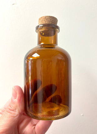 Brown square top bottle