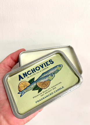 Anchovies candle in a tin