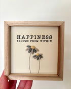 Happiness pebble sign