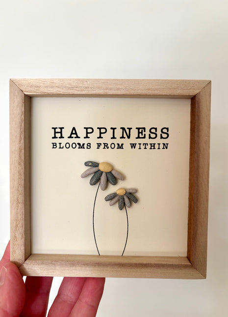 Happiness pebble sign