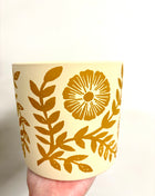 Yellow floral plant pot