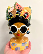 Lady vase with fruit hat