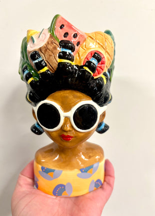Lady vase with fruit hat