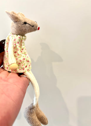 Mouse sitting in floral dress