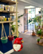 Red gonk with bell hanger