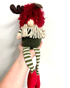 Gnome sitting with long legs